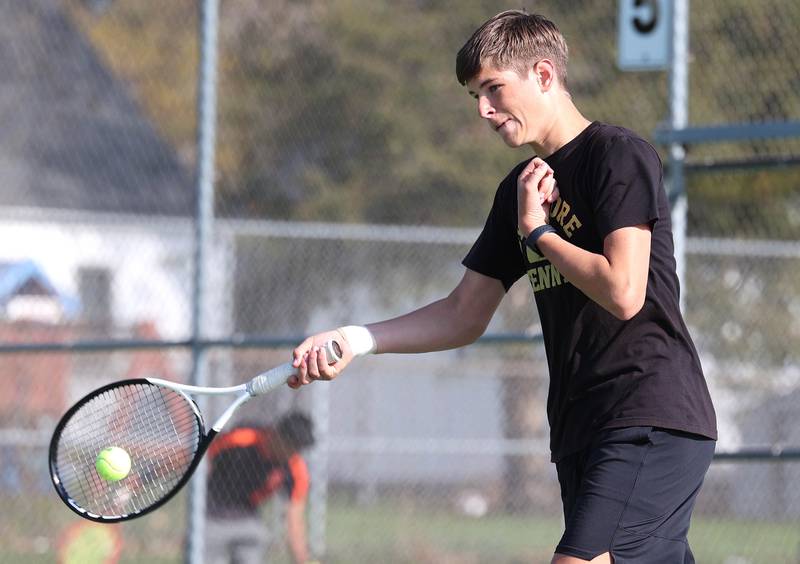 Sycamore number two doubles player Alex Jenkin hits a forehand Wednesday, April 26, 2023, during their match against DeKalb at Sycamore High School.