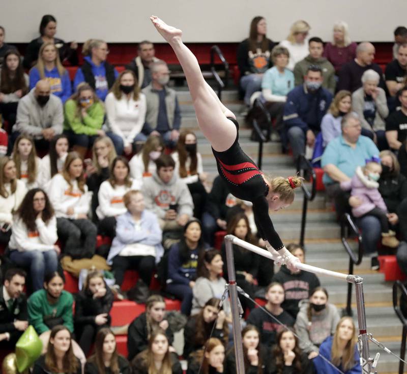 Hinsdale Central's Kelly Klobach competes on the uneven parallel bars during the IHSA Girls Gymnastics State Final meet Friday February 18, 2022 at Palatine High School.