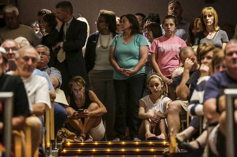 People fill the auditorium Thursday during a Lincoln-Way Community High School District 210 Board of Education meeting in New Lenox. The board voted to close Lincoln-Way North during the meeting.