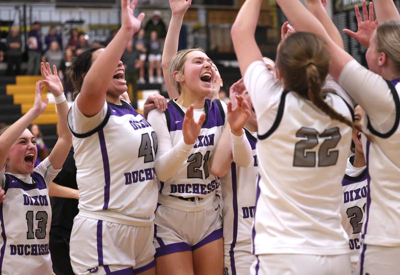 Dixon players celebrate their Class 3A regional championship win over Kaneland Thursday, Feb. 22, 2024, at Sycamore High School.