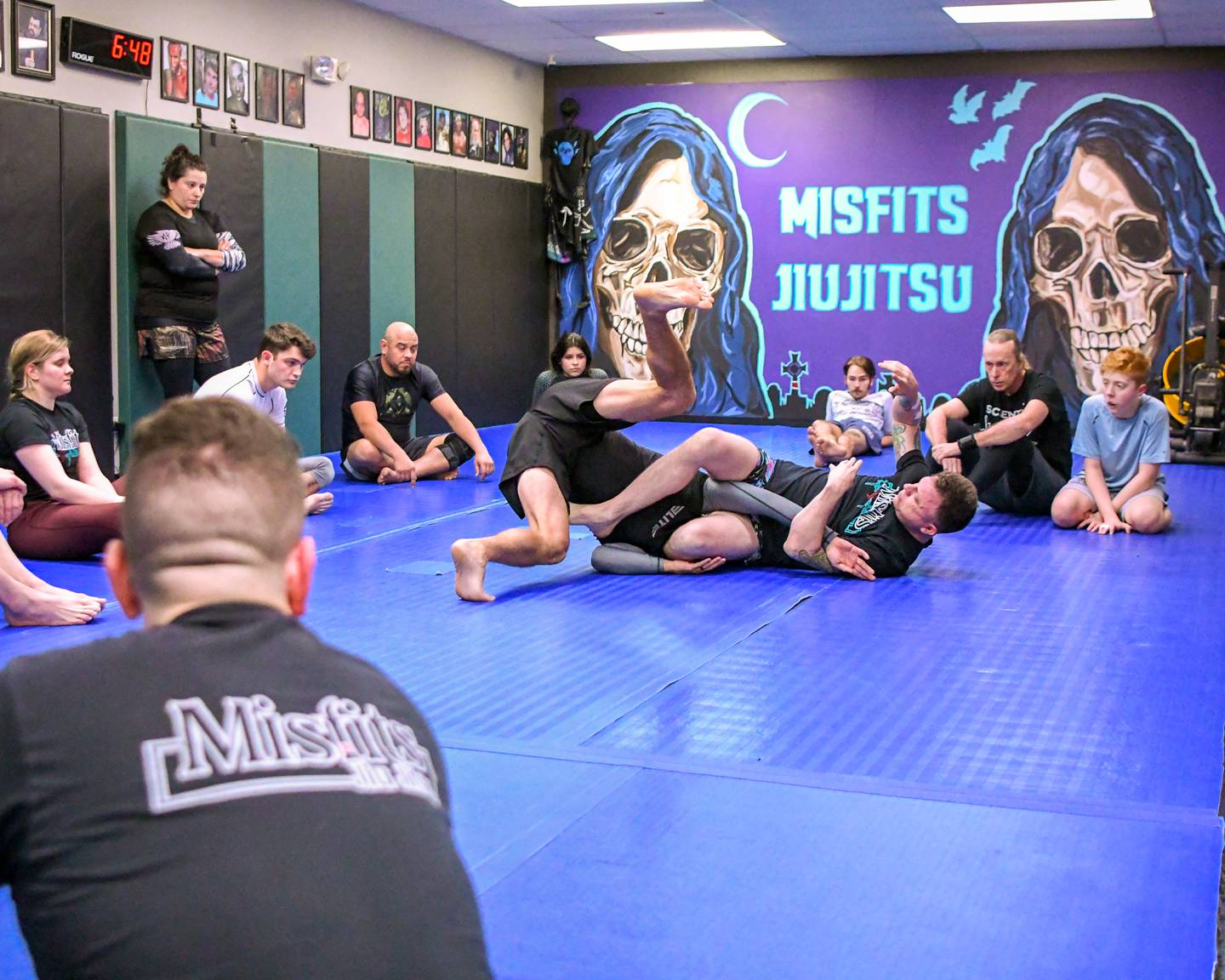 Owner of the Jiujitsu company called Misfits located in St. Charles Brad Edmondson, right, shows how to perform a move during class on Wednesday March 3, 2024.