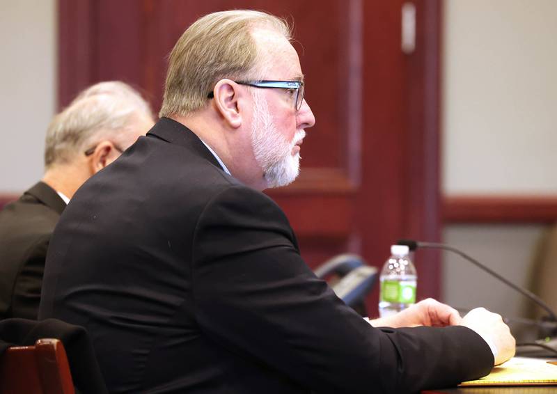 Douglas Moeller, former DeKalb School District 428 superintendent, listens to the reading of the victims impact statement during his sentencing hearing Tuesday, Jan. 1, 2023, at the DeKalb County Courthouse in Sycamore. Moeller was sentenced to community service after being found guilty of one count of non-consensual dissemination of a private sexual image, a class 4 felony.