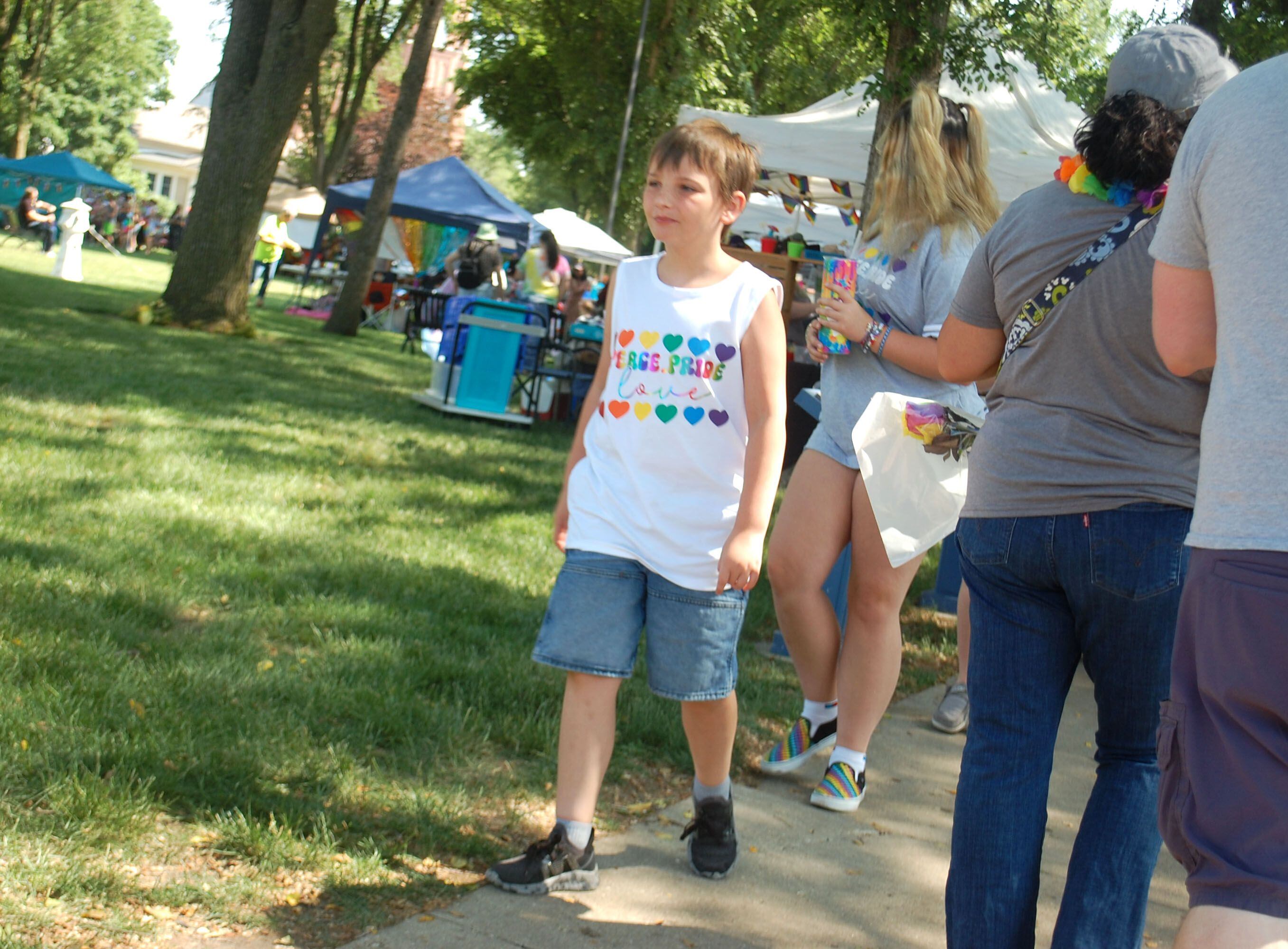 Families explore the vendors and activities at Washington Square in downtown Ottawa during the Ottawa Family Pride Festival on Saturday, June 10, 2023.