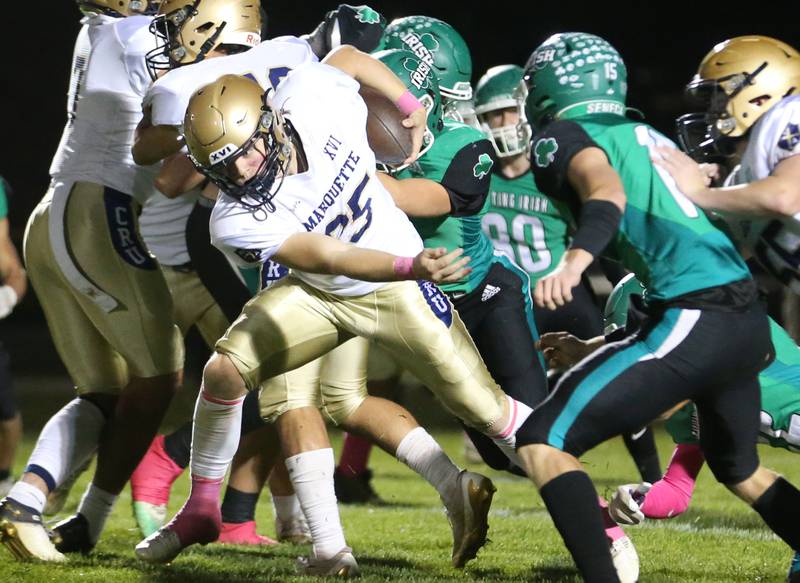 Marquette's Jaxsen Higgins runs the ball against Seneca on Friday, Oct. 18, 2024 at Seneca High School.