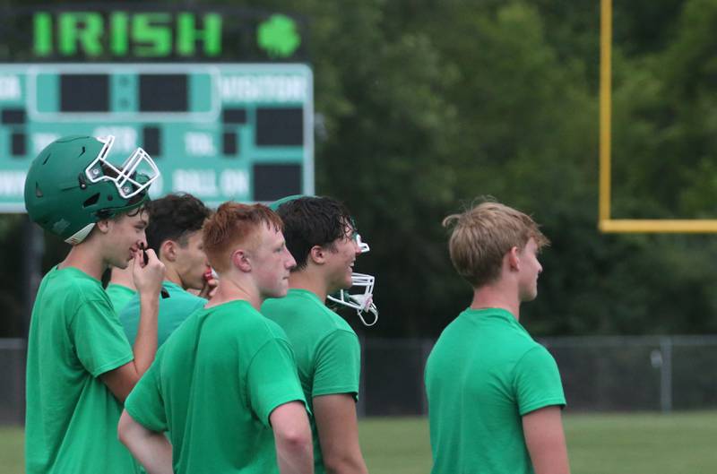 Members of the Seneca football team huddle during a 7-on-7 meet against L-P on Wednesday, July 10, 2024 at Seneca High School.