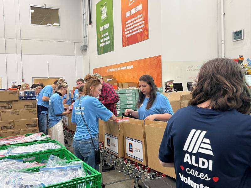 ALDI employees pack disaster relief boxes for Feeding America and the Northern Illinois Food Bank in Geneva, Illinois on May 9, 2023. Photo Credit: ALDI
