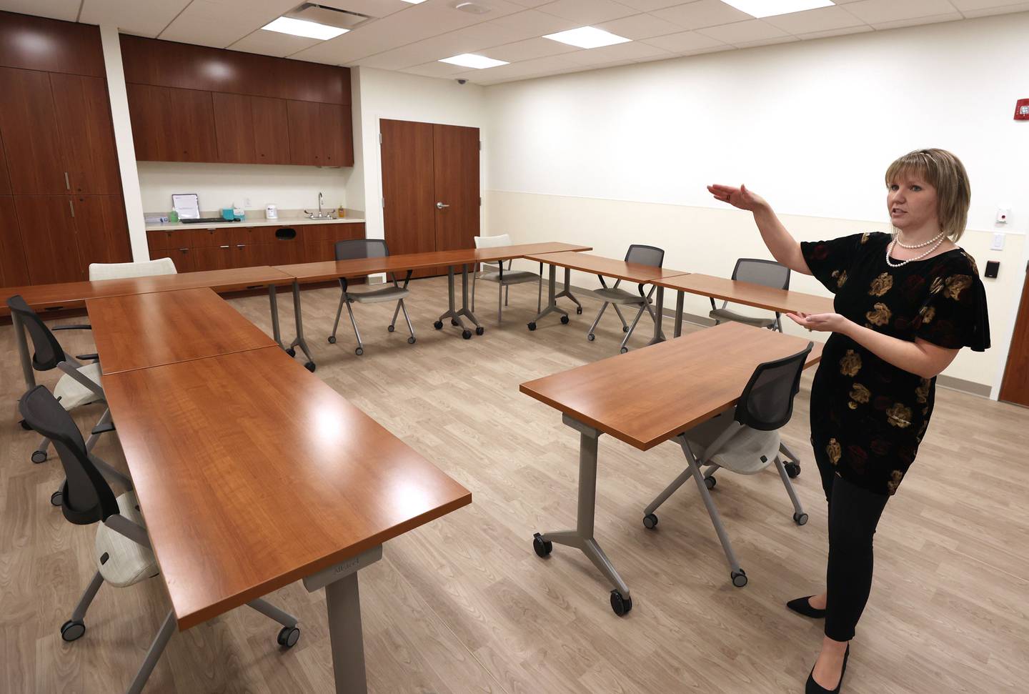 Marissa Kirch, licensed clinical social worker and manager of the partial hospitalization program and intensive outpatient treatment program at the Northwestern Medicine Behavioral Health Services Sycamore Clinic, gives a tour of the new facility Wednesday, Nov. 30, 2022, in Sycamore.