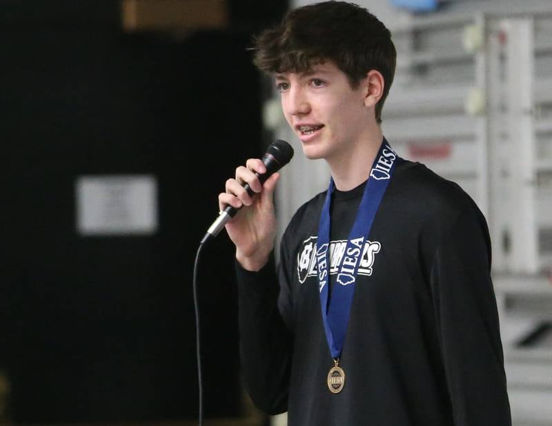 Mendota Holy Cross eighth-grade boys basketball player Cole Tillman delivers a speech to his team during a reception on Tuesday, Feb. 20, 2024 at Holy Cross School. The team beat Pana Sacred Heart 41-33 to win the IESA Class 1A State championship.