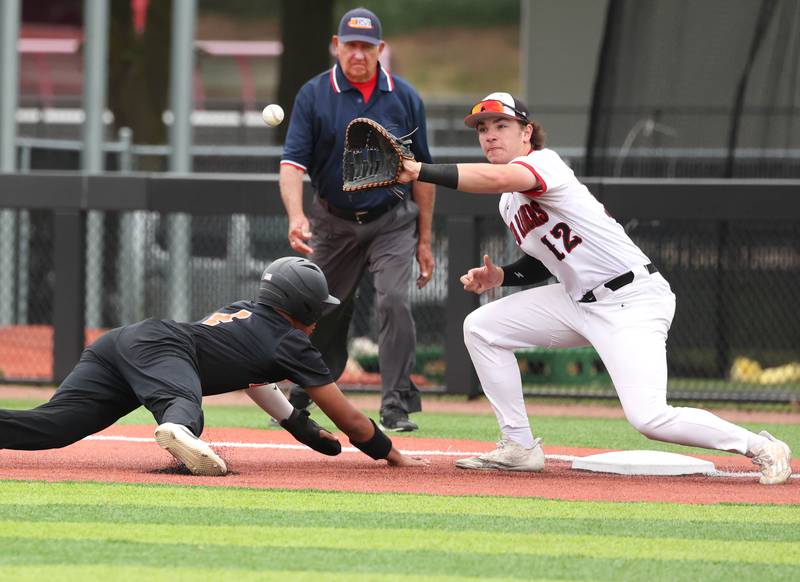 DeKalb's Maddux Clarence gets back to first safely as Huntley’s AJ Putty takes the throw during their Class 4A DeKalb Regional championship game Friday, May 24, 2024, at Ralph McKinzie Field at Northern Illinois University in DeKalb.