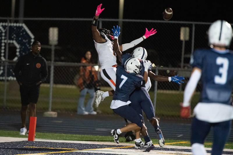 Plainfield South's Orlando Cruz and David Obadein block a pass intended for Dekalbs Davon Grant, preventing a Dekalb touchdown during a game Friday Sept. 6, 2024 at Plainfield South High School in Plainfield