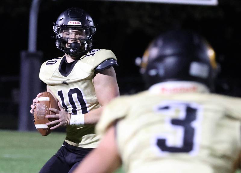 Sycamore's Burke Gautcher looks for Carter York during their game against Morris Friday, Oct. 18, 2024, at Sycamore High School.