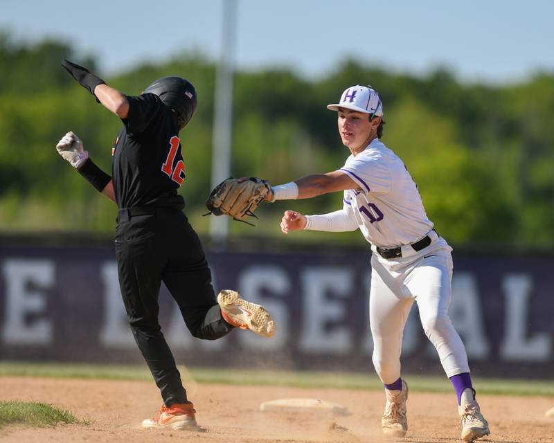 Hampshire’s short stop Dominic Broecky, right, tags out DeKalb’s base runner Jack Ager  during the regional game on Thursday May 25th held at Hampshire High School.