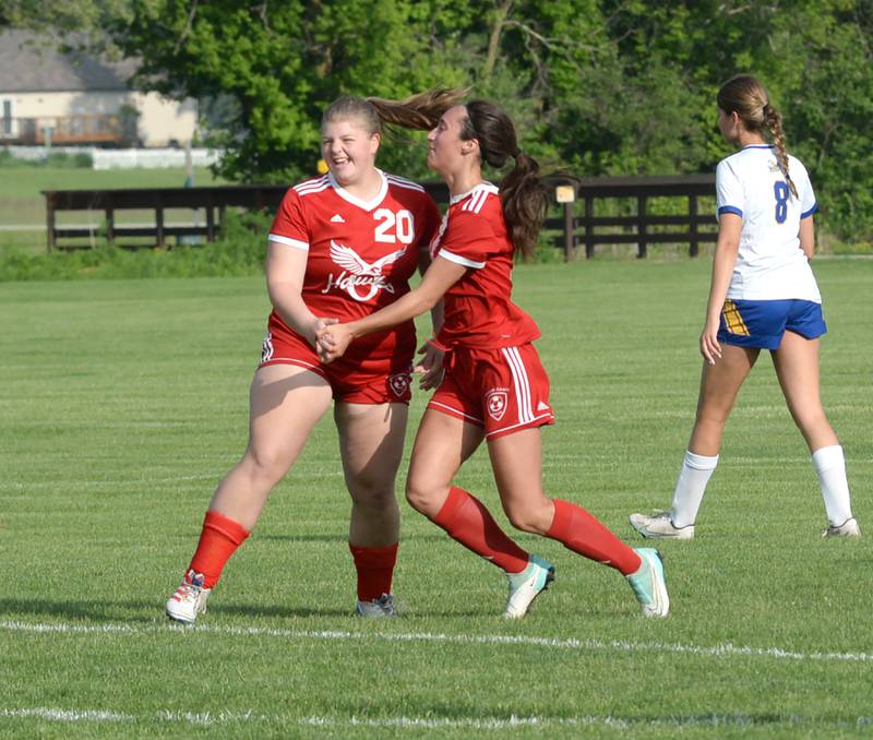 Oregon's Noelle Girton (20) celebrates with Kenna Wubbena (9) after the pair teamed up to give the Hawks a 3-1 lead over Aurora Central Catholic at the 1A Oregon Regional on Tuesday, May 14, 2024.