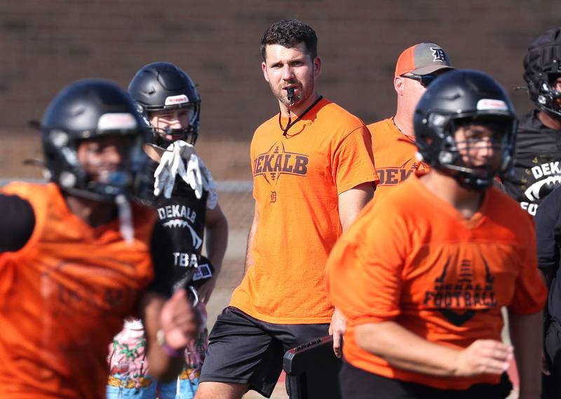 Dekalb football head coach Derek Schneeman watches his team Monday, Aug. 12, 2024, at the school during the first practice of the regular season.