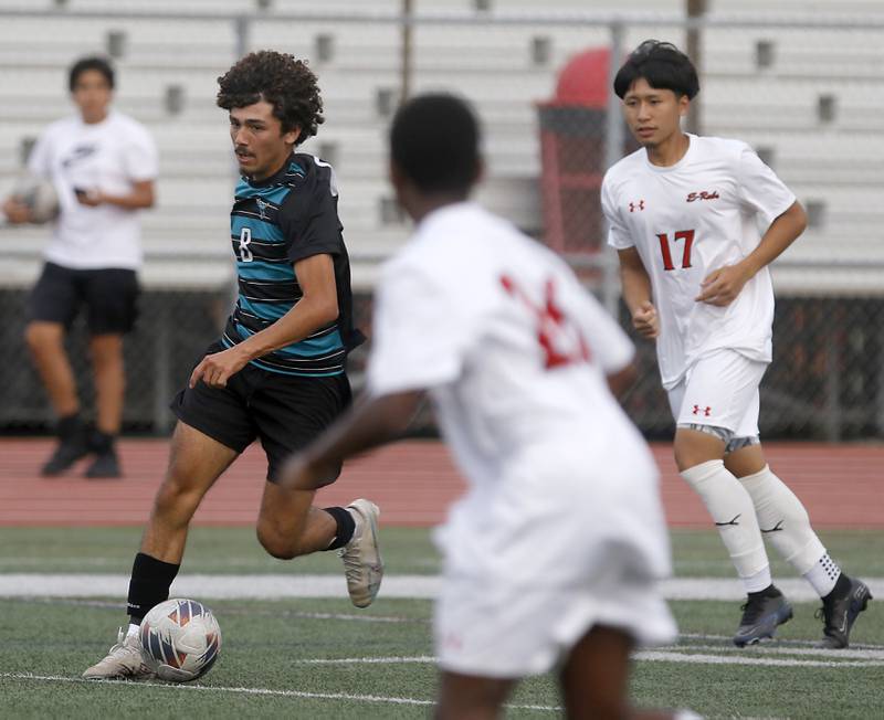 Woodstock North's Cesar Salas priest to make a run towards the goal between Rockford East players during a nonconference soccer match on Thursday, Sept. 5, 2024, at Huntley High School.