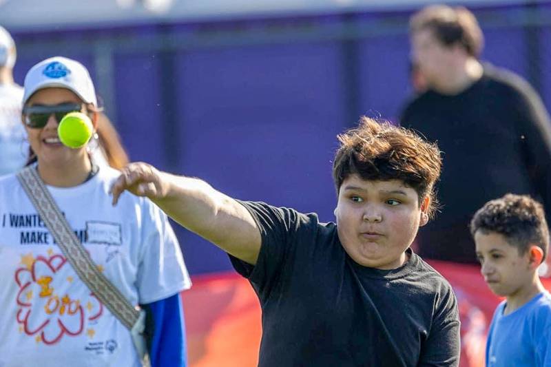 Drauden Point Middle School sixth grader Danny Arrez competes in the tennis ball throw at the Special Olympics Region E Spring Games on May 4, 2024. Arrez is one of five middle school athletes from District 202 who competed in the Illinois Special Olympic Games in Boomington-Normal