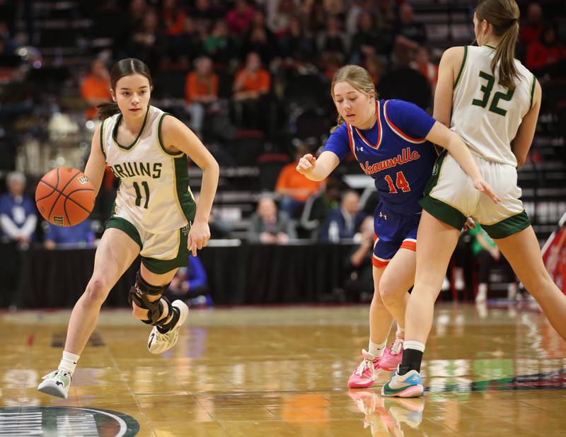 St. Bede's Bailey Engeles dribbles down the floor as Okawville's Brynn Rhodes has a pick set on her by St. Bede's Quinn Mc Clain during the Class 1A State semifinal game on Thursday, Feb. 29, 2024 at CEFCU Arena in Normal.