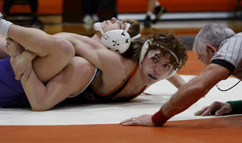 Crystal Lake Central’s Alessio Pezzella tries to pin Plano’s Caidan Ronning during the150x-pound championship match of a the IHSA 2A Crystal Lake Central Wrestling Regional on Saturday, Feb. 3, 2024, at Crystal Lake Central High School.