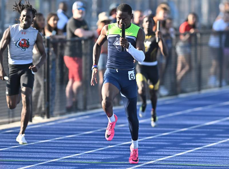 Oswego East's Nigel Grisby races to the finish line in the 4x200 meter relay during the IHSA 3A Sectional track meet  on Friday, May. 17, 2024, at Joliet.