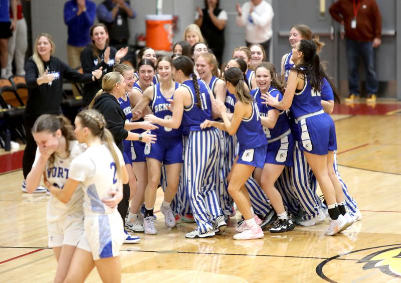Geneva players celebrate their win as St. Charles North’s Katrina Stack and Reagan Sipla console one another following the  Class 4A Batavia Sectional semifinal gameon Tuesday, Feb. 20, 2024.