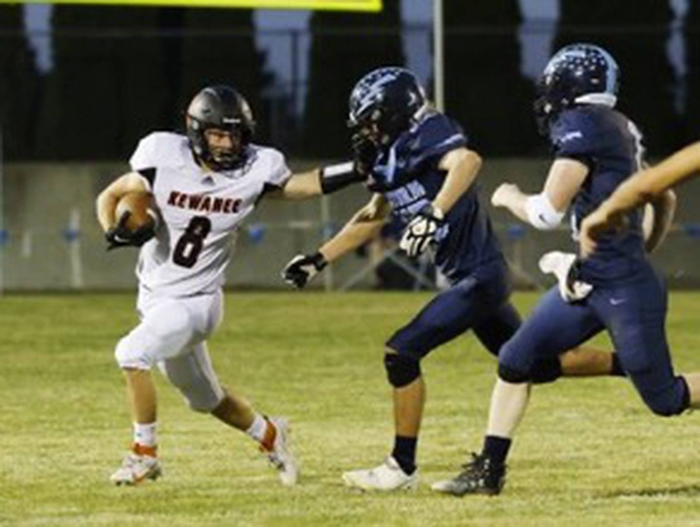 Bureau Valley's Drake Hardy and Bryce Helms (right) chase down Kewanee' s Ben Taylor Friday night at Storm Stadium.