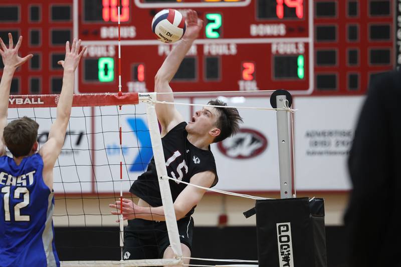 Plainfield North’s Cole Clarke hits a shot against Lincoln-Way East on Tuesday, April 2, 2024.