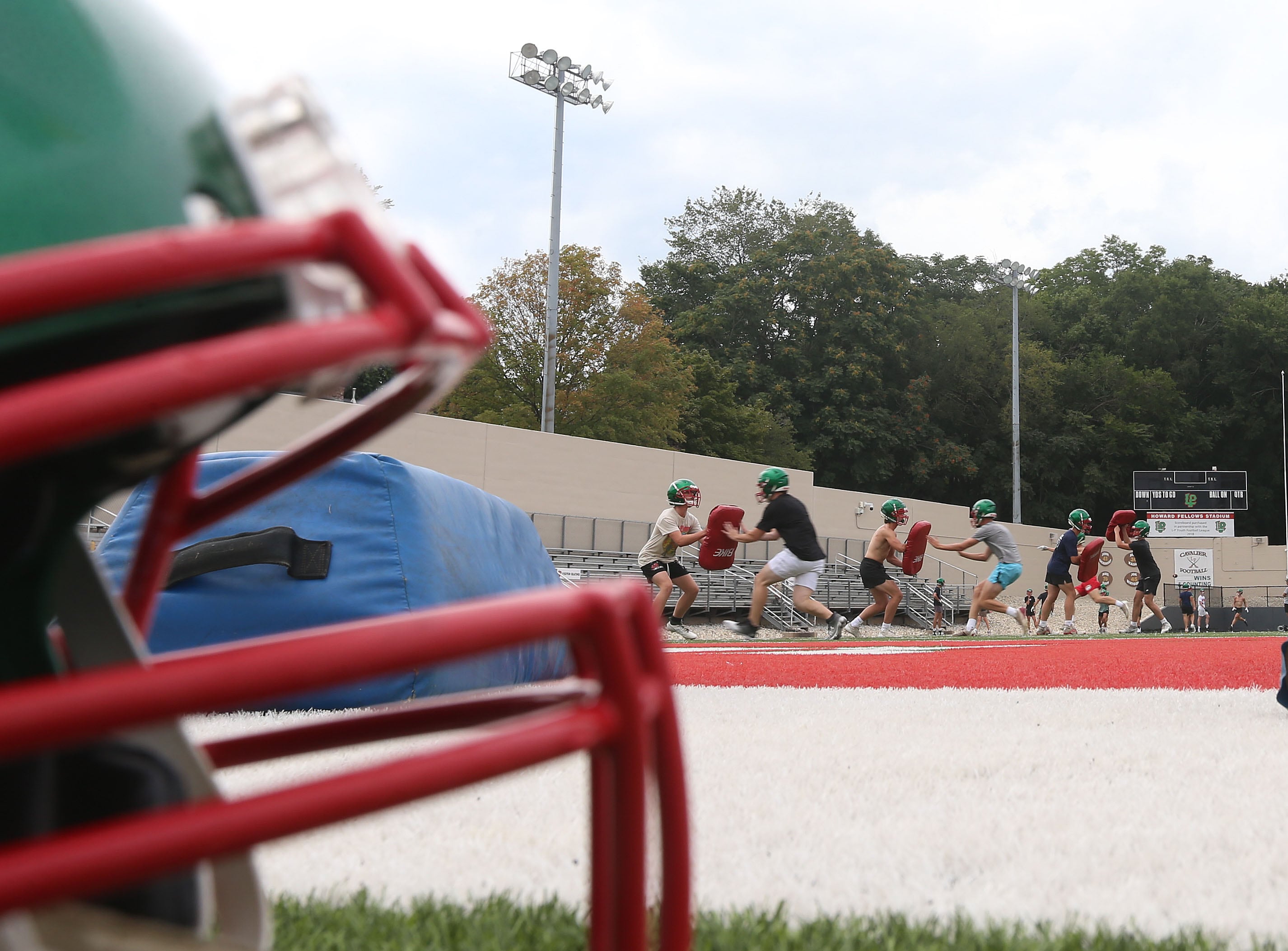 Members of the L-P football run drills during the first day of football practice on Monday, Aug. 12, 2024 at Howard Fellows Stadium.