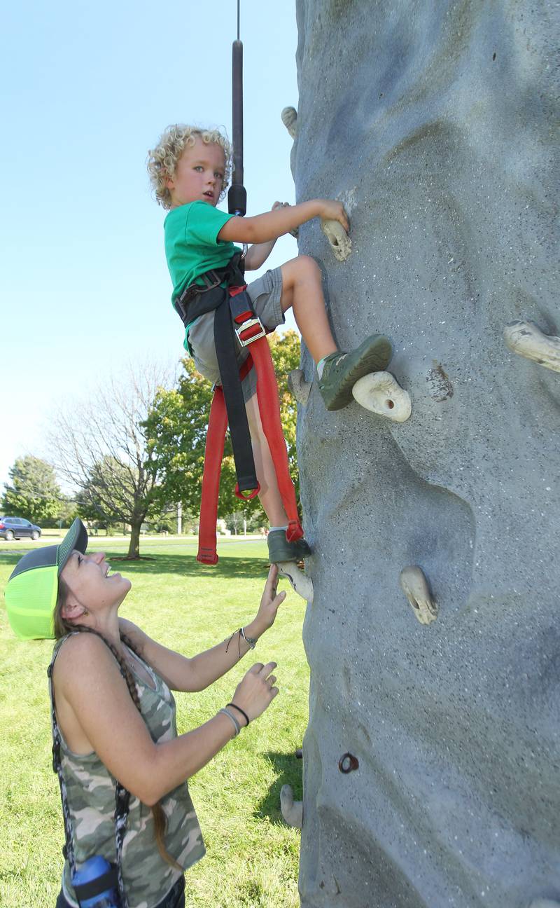 Tiffany Gurske, of Powers Lake, Wis., cheers on her son, Elijah, 5, as he makes his way up the climbing rock wall during the Fall Festival at Grant Township Center on October 1st in Ingleside. The event was sponsored by the Village of Fox Lake and Grant Township.
Photo by Candace H. Johnson for Shaw Local News Network