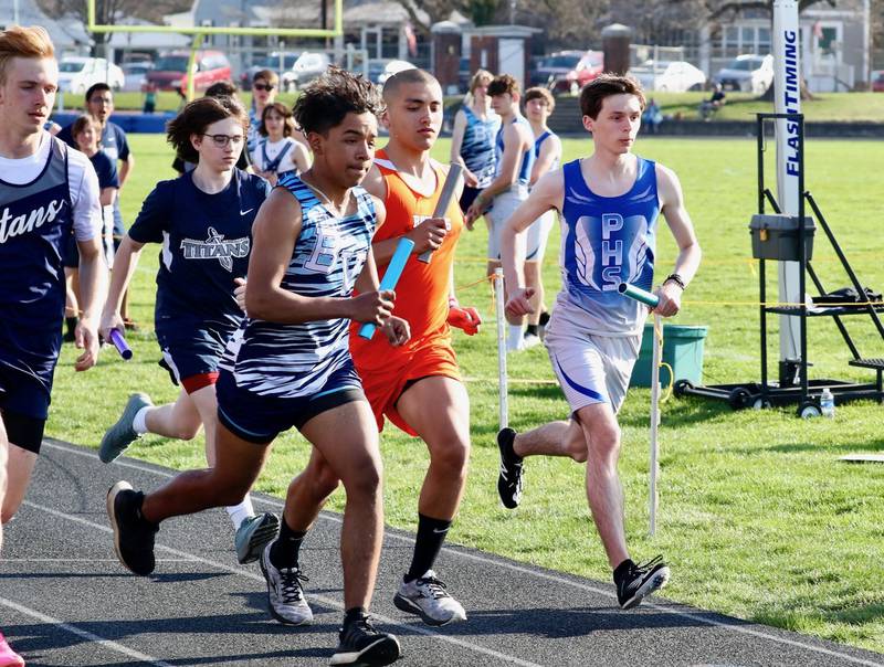 Relay runners run in Tuesday's Howard-Monier Invite.