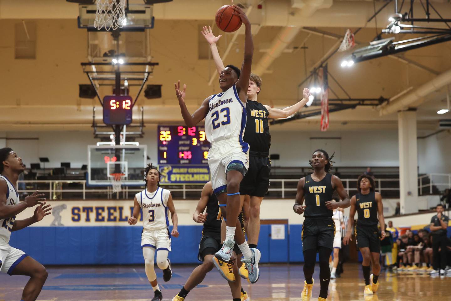 Joliet Central’s Danny Thompson lays in a shot against Joliet West on Saturday, Jan. 27th, 2024 in Joliet.