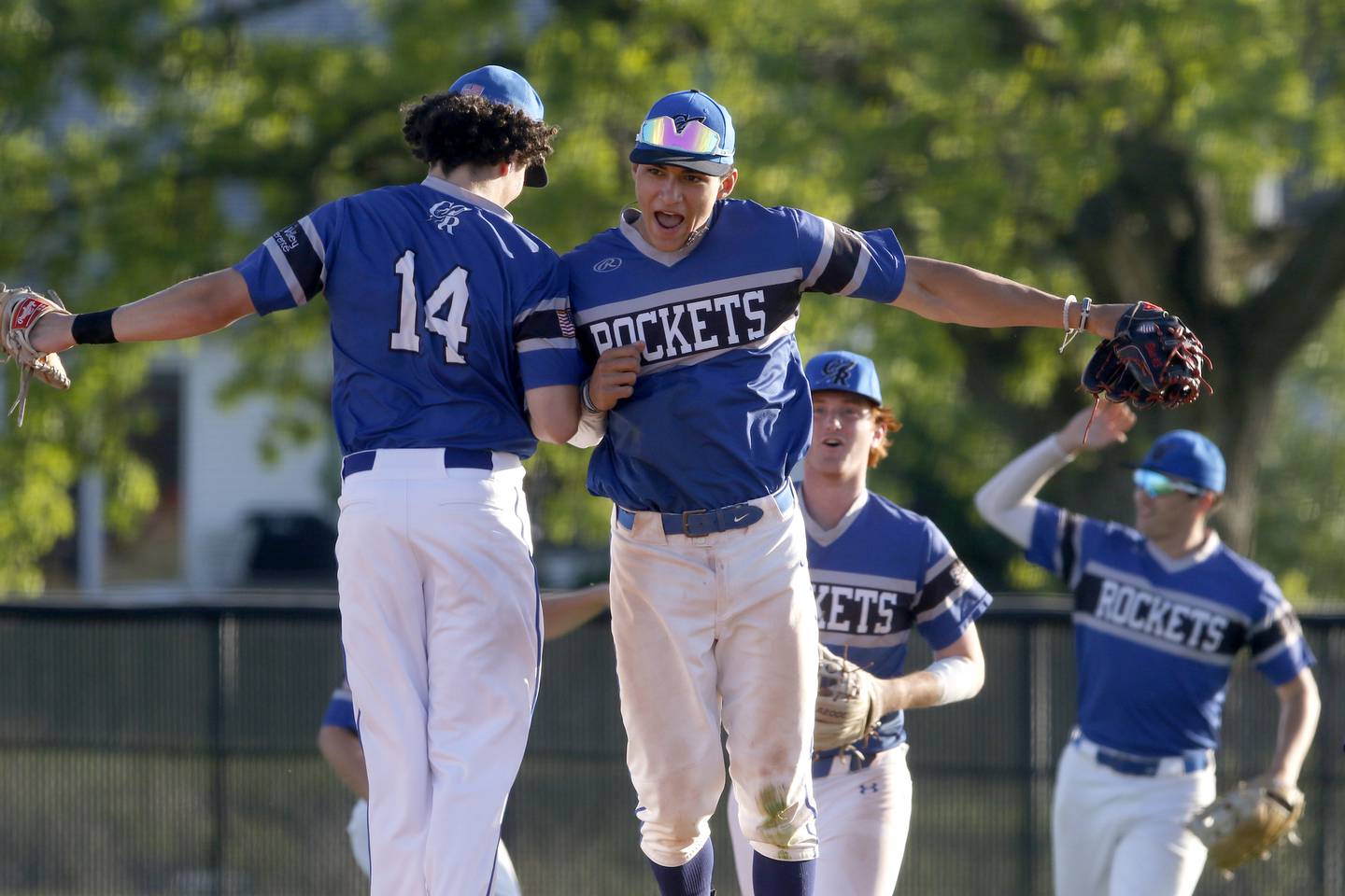 Burlington Central's Elliott Alicea (right) celebrates with teammate, Connor Finn, after Alicea made a diving catch to end the game during a Fox Valley Conference baseball game against Huntley on Friday, May 10, 2024, at Huntley High School.