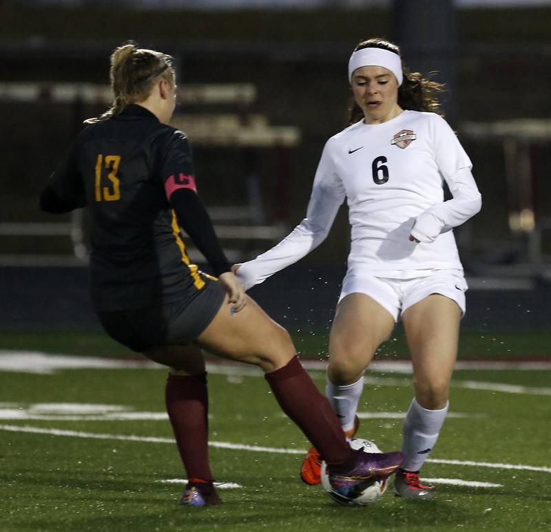 McHenry’s Becca D’Agostino takes the ball away from Richmond-Burton’s Jordon Otto during a non-conference girls soccer match Thursday, March 16, 2023, at Richmond-Burton High.