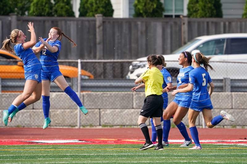 Lyons’ Izzi Wirtz (12) celebrates with Zibby Mchaelson (left) after scoring a goal against Hinsdale Central during a Class 3A Hinsdale Central Sectional semifinal soccer match at Hinsdale Central High School in Hinsdale on Tuesday, May 21, 2024.