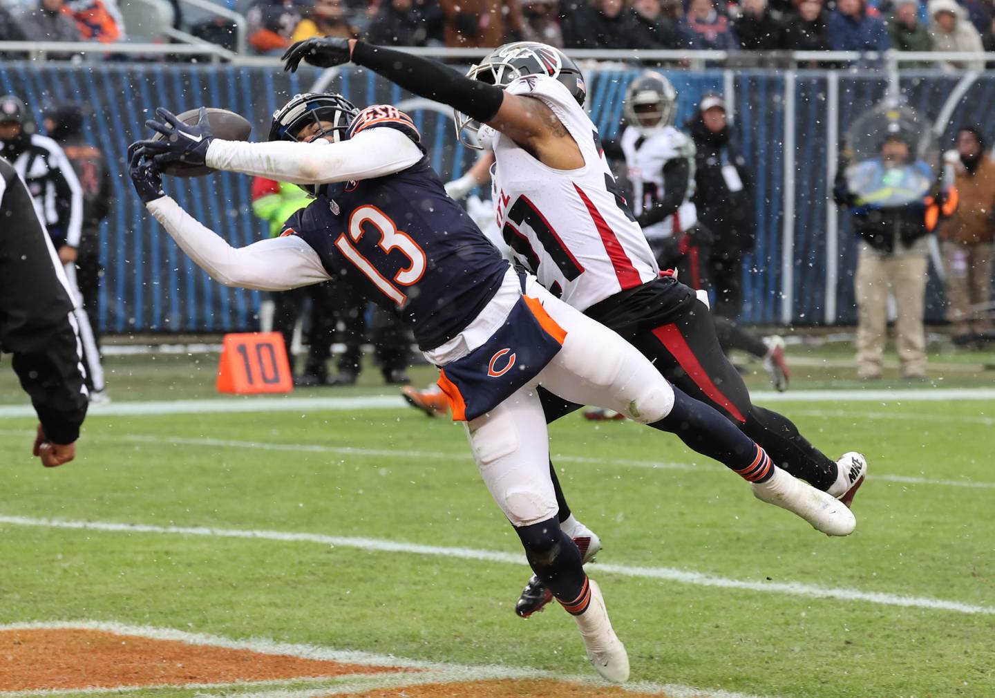 Chicago Bears wide receiver Tyler Scott can’t quite make the catch in the end zone as Atlanta Falcons cornerback Mike Hughes provides the coverage during their game Sunday, Dec. 31, 2023, at Soldier Field in Chicago.