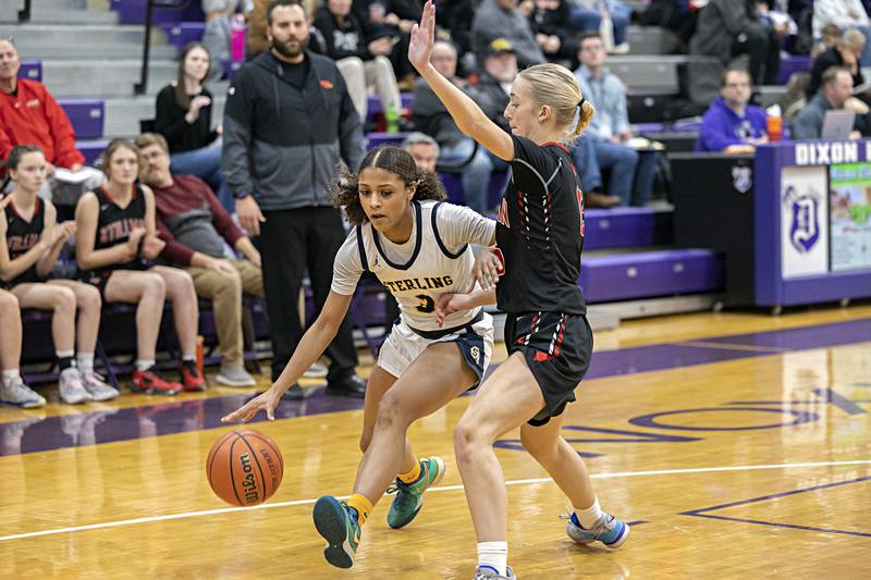 Sterling’s Delali Amankwa handles the ball against Stillman Valley’s Taylor Davidson Thursday, Dec. 28, 2023 at the Dixon KSB Holiday tournament.