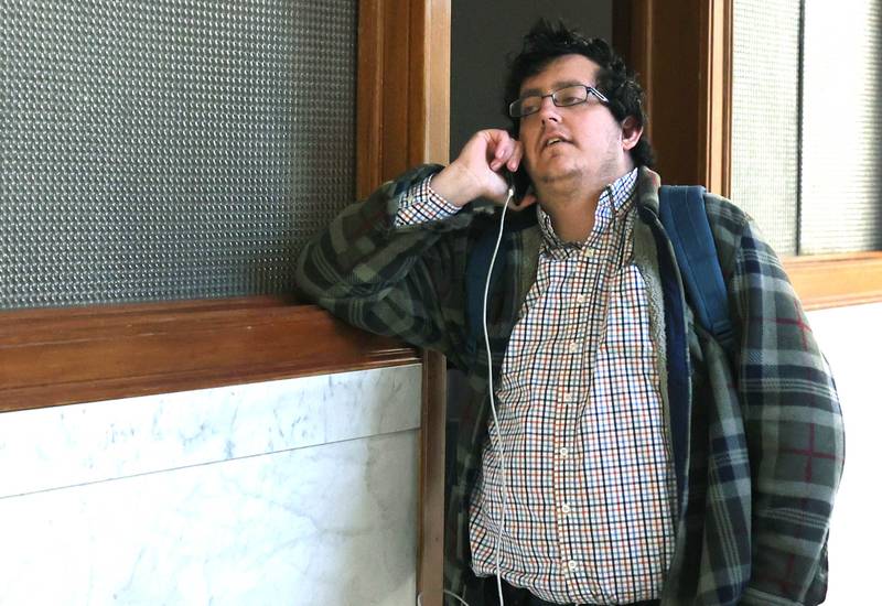 DeKalb City Clerk Sasha Cohen talks on the phone to someone regarding his being replaced as the person to accept candidate filings Monday, Dec. 12, 2022, at City Hall. Filing opened Monday at 8:30 a.m. and Ruth Scott, recording secretary to the DeKalb City Council, was on hand to accept the paperwork for candidates who were filing.