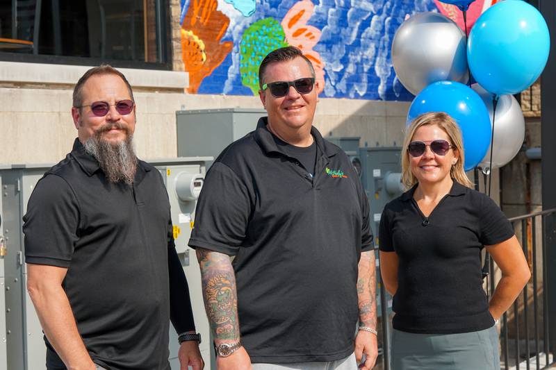 Left to Right: Artist CJ Hungerman, McNally’s Heating & Cooling Owner Brian McNally, St. Charles Mayor Lora Vitek at the mural dedication in downtown St. Charles on June 30, 2023.