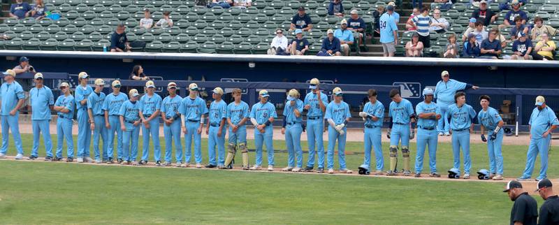 Members of the Marquette baseball team line up before the National Anthem during the Class 1A State championship game on Saturday, June 1, 2024 at Dozer Park in Peoria.
