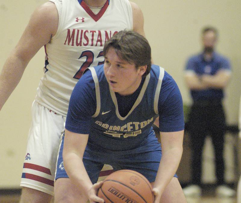 Princeton's Jordan Reinhardt is guarded by Morrison's Carson Straling during the Morrison vs Princeton class 2A basketball regional final at Prophetstown High School on Friday, Feb. 23 .