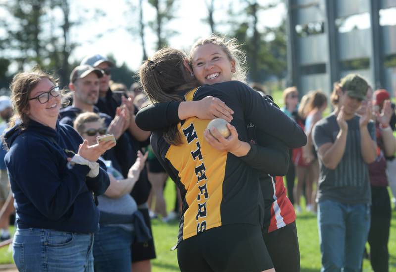 Forreston-Polo's Sydni Badertscher gets a hug from Lena-Winslow's Molly Amendt after qualifying for the state meet in the shot put at the 1A Oregon Sectional on Friday. May 10, 2024. Badertscher finished second with a throw of 11.26 meters, 36' 11.5" to qualify for next week's state meet at Eastern Illinois University in Charleston.