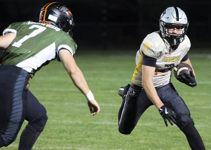 Kaneland's Dylan Sanagustin tries to get by DeKalb's Matthew Clayton during their game Friday, Sept. 13, 2024, at Kaneland High School in Maple Park.