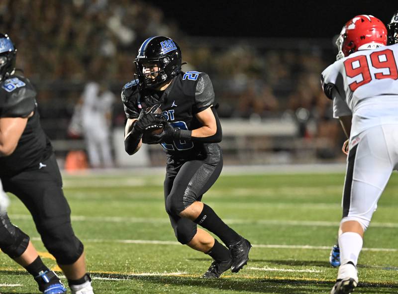 Lincoln-Way East's Brody Gish carries the ball during a non-conference game against Maine South on Friday, Aug. 30, 2024, at Frankfort. (Dean Reid for Shaw Local News Network)