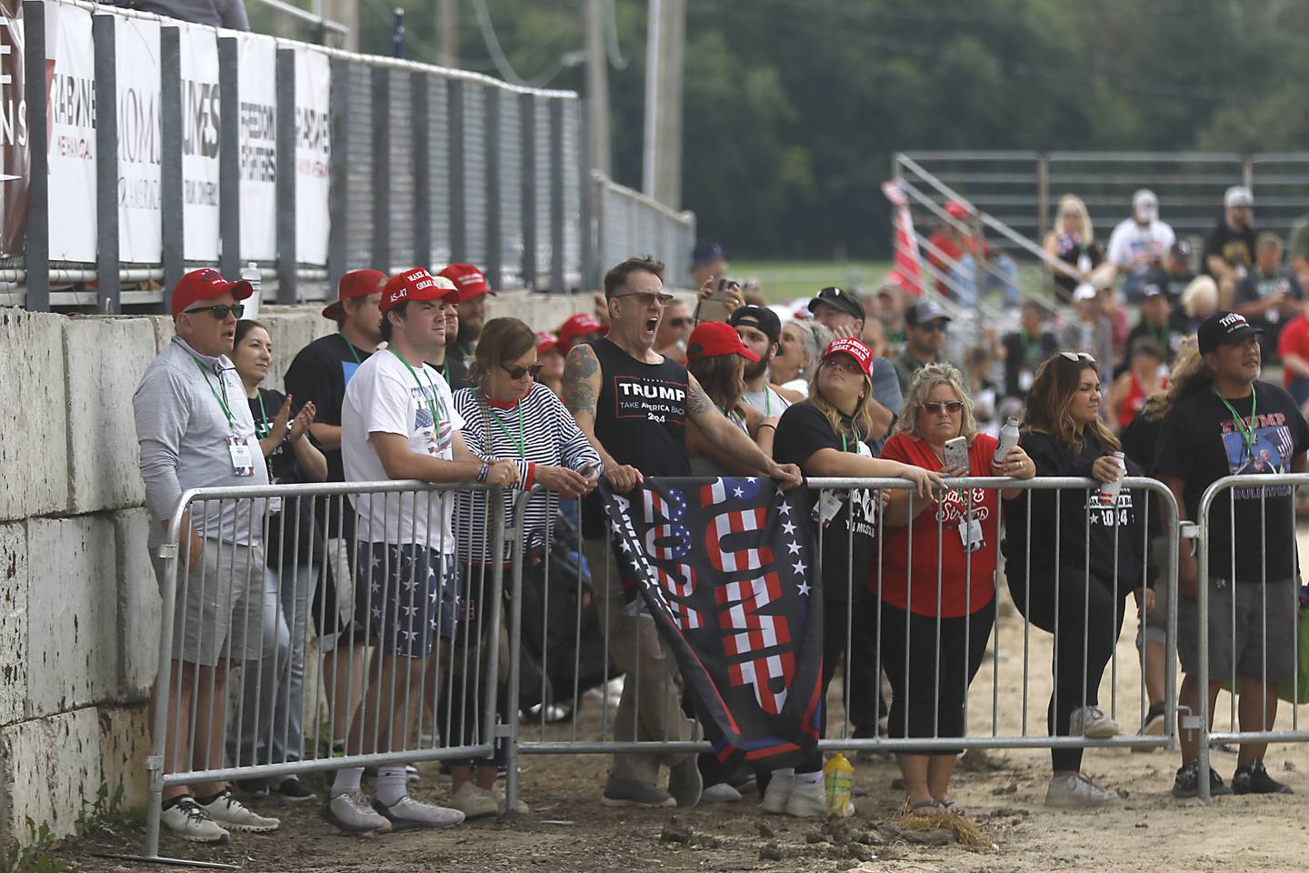 People listen to speakers during the Trump Now-Save the American Dream Rally at the McHenry County Fairgrounds on Sunday Aug. 18, 2024, in Woodstock.