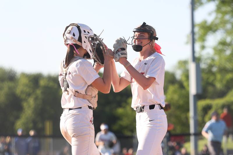 Lincoln-Way Central’s Lisabella Dimitrijevic, right, is greeted by her catcher Lucy Cameron after the Knights win against Lincoln-Way East in the Class 4A Lincoln-Way Central Sectional semifinal on Wednesday, May 29, 2024 in New Lenox.