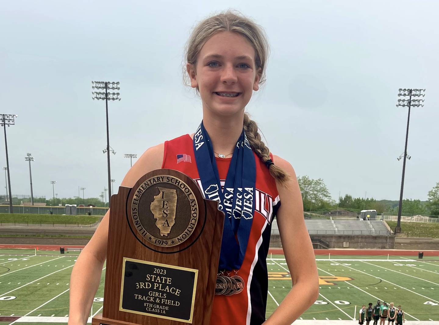 Holy Family eighth grader Aubrey Duttlinger won three IESA state titles and earned a medal in a fourth event Saturday. She was Holy Family's only competitor but racked up enough points by herself to bring home the third-place team trophy.