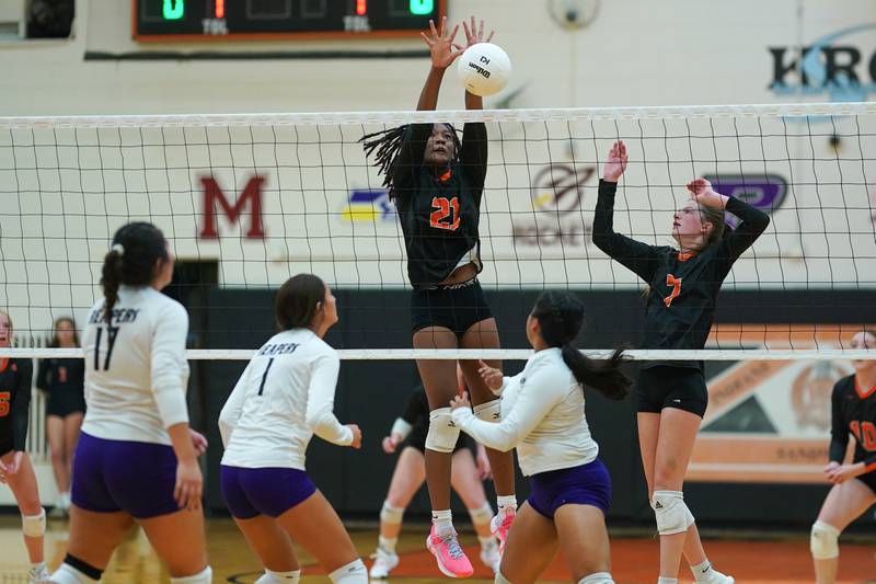 Sandwich’s Alayla Harris (21) blocks a kill attempt by Plano's Camila Nunez (15) during a volleyball match at Sandwich High School on Tuesday, Sep 10, 2024.