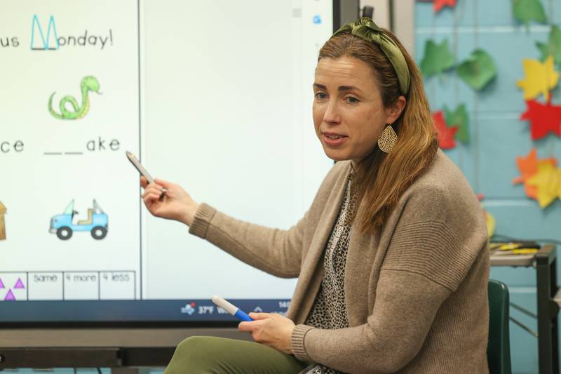 Geraldine Brewster works on a smartboard with her students at St. Mary Immaculate Parish School on Monday, April 17, 2023 in Plainfield.