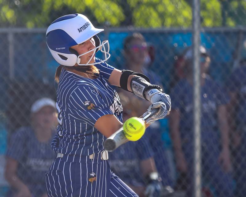 Newark's Adelaide Johnson (22) connects on a pitch during Class 1A Newark Regional final game between St. Edwards at Newark. May 17th, 2024.