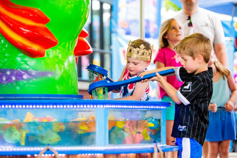 Brothers Gene, 4, and Owen, 5, Szul of Lisle play a fishing game during the Downer’s Grove Rotary Fest, Saturday, June 22, 2024.

Suzanne Tennant/For Shaw Local News Media