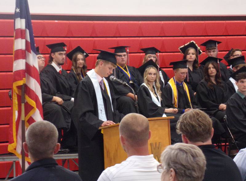 Woodland High School graduate Jonathan Moore gives the closing statement Sunday, May 19, 2024, to fellow graduates at the school's ceremony in the gymnasium.